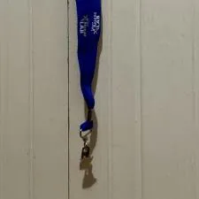 Customer photo from Alex of our Lanyard with Metal Bulldog Clip - 3/4", a blue lanyard with white text on it