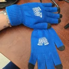 Customer photo from Angela of our Touch Screen Gloves - Premium Colours - 24 hr, a pair of blue gloves on a table