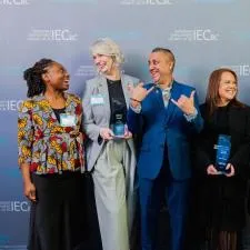 Customer photo from Vania of our Harmony Crystal Award, a group of people holding awards