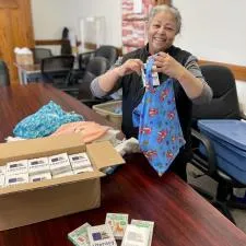 Customer photo from Tracy of our Flash Cards - Alphabet, a woman holding a blue tie
