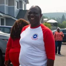 Customer photo from Babatunde of our Gildan Heavy Cotton 3/4 Sleeve Raglan T-Shirt - Screen, a man in a red and white shirt
