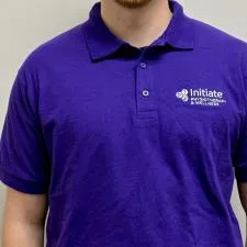 Customer photo from Initiate of our Gildan DryBlend 50/50 Jersey Polo, a man wearing a purple polo shirt