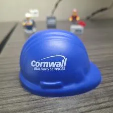 Customer photo from Chris of our Stress Reliever - Hard Hat, a blue hard hat on a table